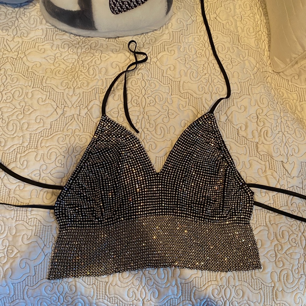 Sparkly silver halter top with two tie back.